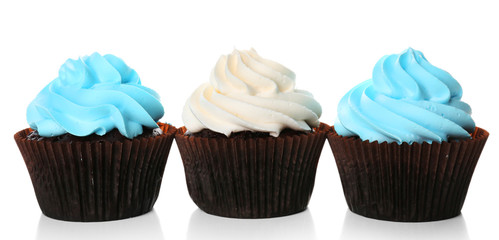 Fresh delicious cupcakes in a row isolated on white background