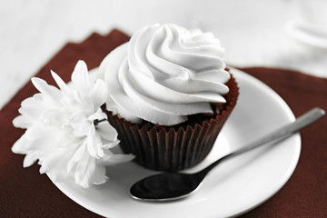 Tasty cupcake on served table, close up