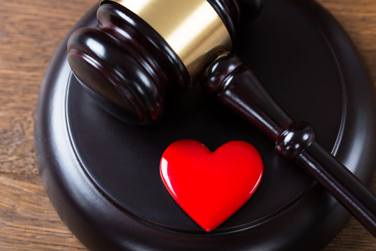 Mallet And Heart On Table In Courtroom