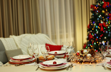 Christmas table setting with holiday decorations background