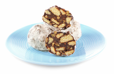 Chocolate salami candies with powder, close up