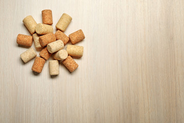 Wine corks on light wooden background