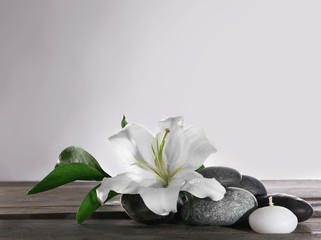 Spa still life with beautiful flower and candle on white background