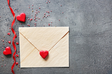 Blank present Valentine card with small hearts on grey textured background