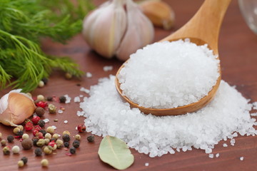 Fototapeta na wymiar Salt in spoon and spices