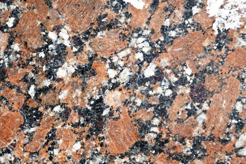 Stone background polished granite tiles. Closeup.