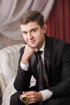 Attractive man dressed in strict black suit
