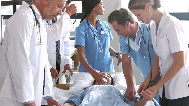 Team of doctor examining a patient
