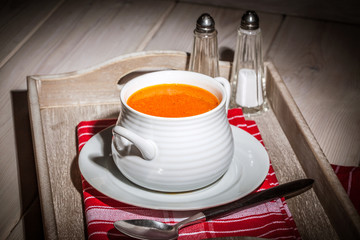 Fresh tomato soup in a white bowl.