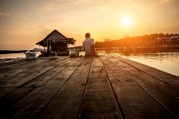 Fototapeta na wymiar Silhouette of Fisher fishing in the Phang Nga Bey, Thailand