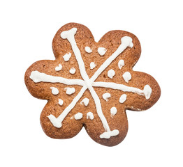 Gingerbread cookie made in the shape of a Christmas star (snowflake) isolated on the white