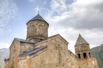 Fototapeta na wymiar Holy Trinity Church (Tsminda Sameba) near Gergeti village, Georgia