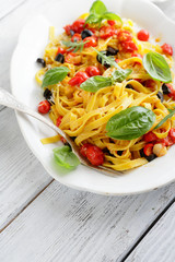 pasta with tomato on vintage plate