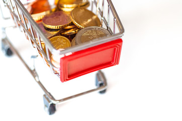 A shopping cart with euro coins, symbolic photo for purchasing