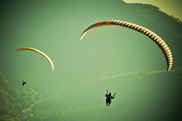 Paragliders passion is paragliding at the sky