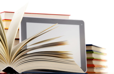 Composition with books and tablet computer isolated on white