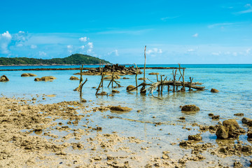 beautiful exotic beach in Thailand with fishing gear at low tide