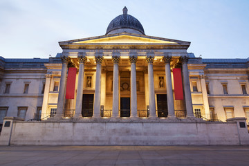 The National Gallery facade illuminated at dusk in London