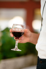 a man holding a glass of wine