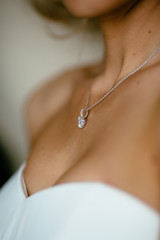 pendant on the neck of the bride