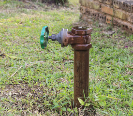 ball valve and metal pipe in garden