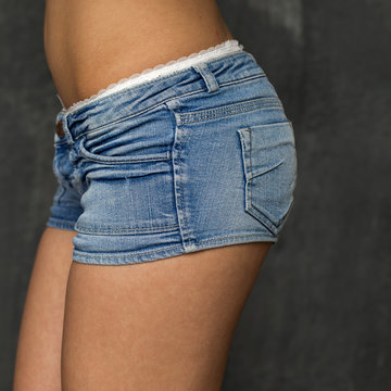 Beautiful woman body in denim jeans shorts