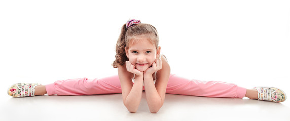 Cute little girl doing gymnastic exercise