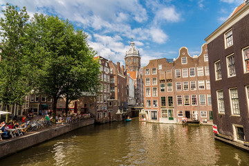 Fototapeta na wymiar Canal and St. Nicolas Church in Amsterdam