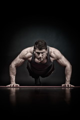 athletic young man exercising