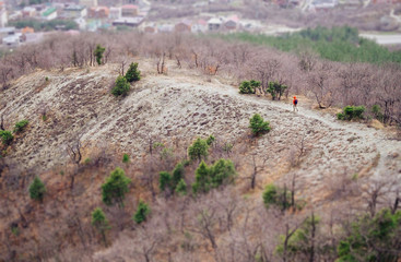 Minimal person in massive landscape