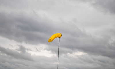 Detail of a windsock under a  beautiful sky