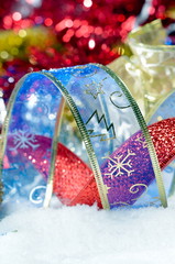 colorful christmas decorations over snow