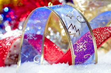 colorful christmas decorations over snow