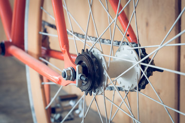 fixed gear bicycle parked with wood wall, close up image