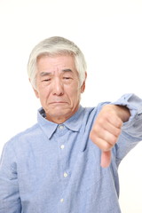 senior Japanese man with thumbs down gesture