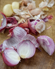Red Onion and garlic on a wooden chopping board,