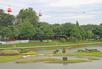 lake with miniatures of indonesian islands in park Taman Mini