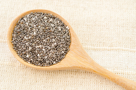 Chia seed in wooden spoon.