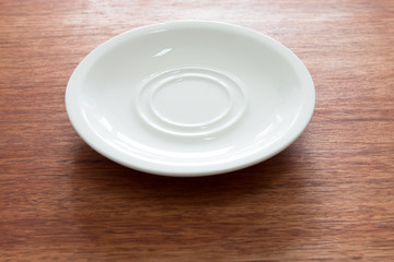 Empty plate on the wooden table