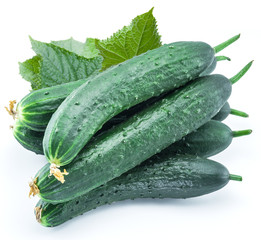 Cucumbers with leaves on the white background.