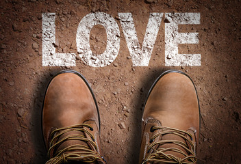 Top View of Boot on the trail with the text: Love