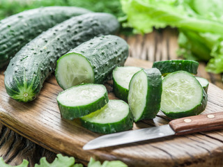 Cucumbers on the wooden table.
