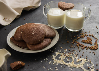 healthy cookies made from buckwheat flour with two cups of milk. Valentine's Day. - obrazy, fototapety, plakaty