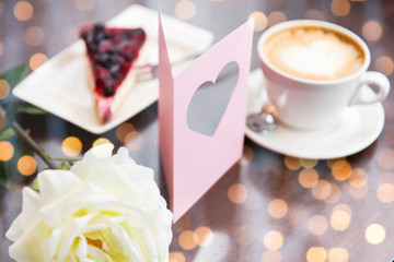 close up of greeting card with heart and coffee