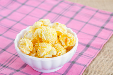 Homemade Golden Caramel Popcorn in a Bowl