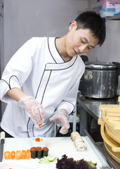 Japanese chef preparing a meal in a restaurant