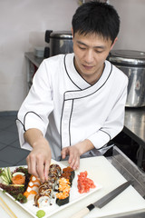 Japanese chef preparing a meal in a restaurant