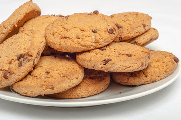 Oat cookies in plate isolated on white background