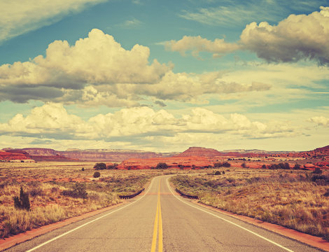 Vintage old film stylized country road, travel concept.