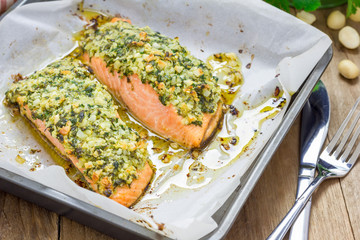 Baked salmon with macadamia-cilantro crust in a baking dish